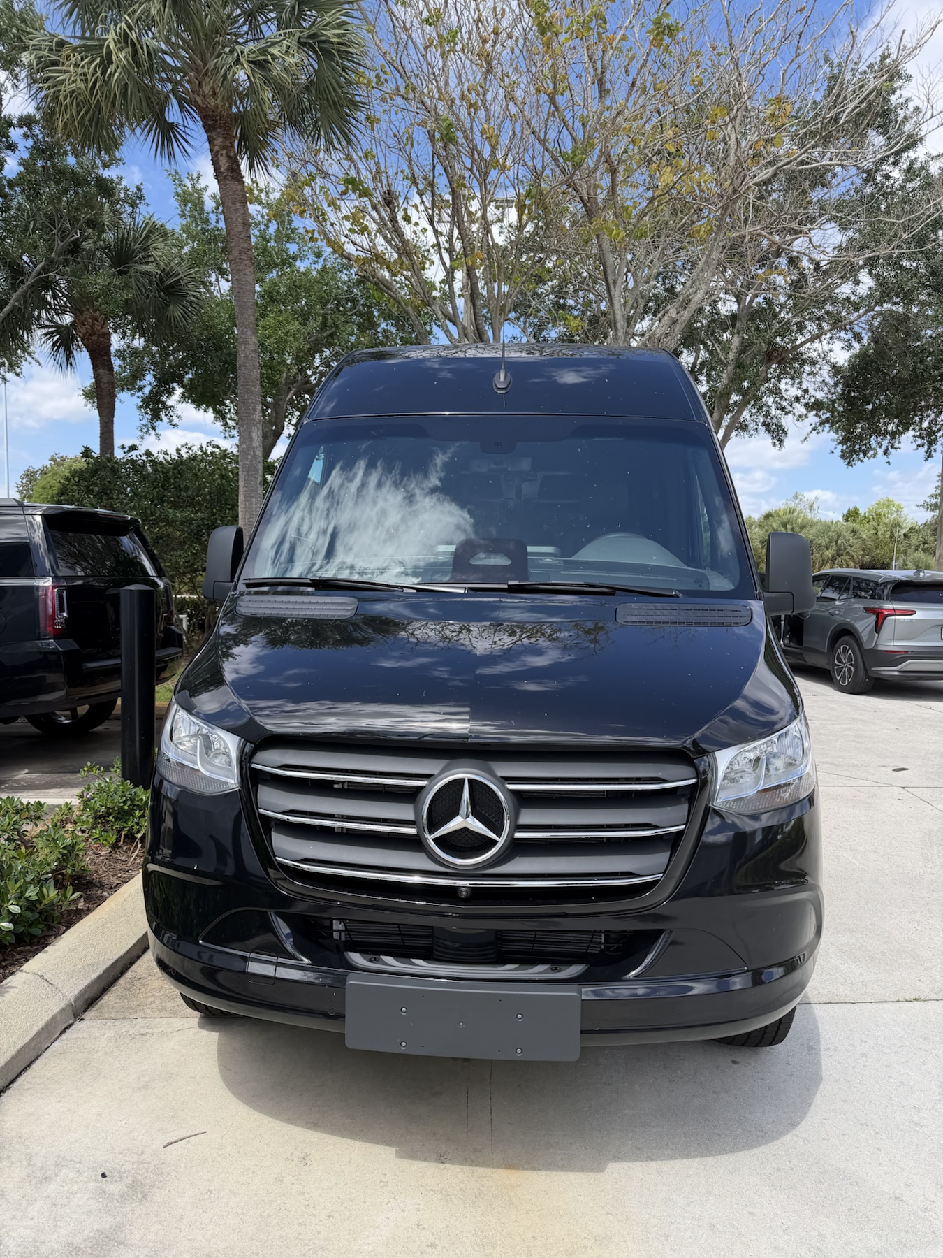 Front exterior view of the black Mercedes-Benz Sprinter van