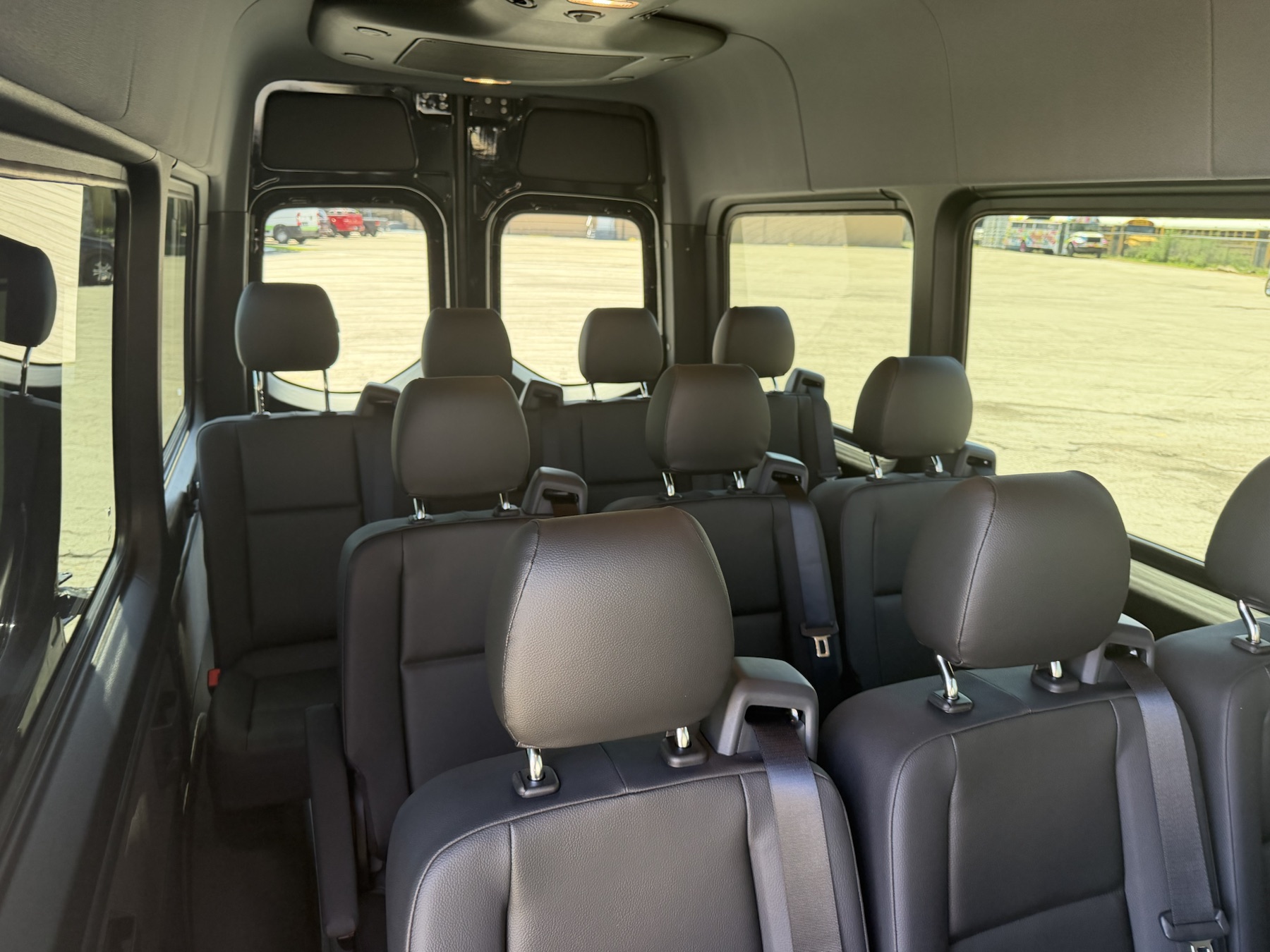 Interior passenger cabin inside the black Mercedes-Benz Sprinter van